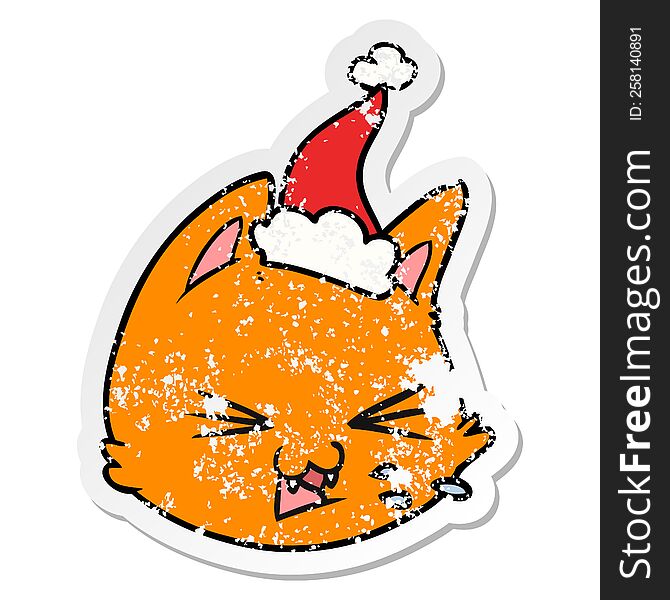 spitting distressed sticker cartoon of a cat face wearing santa hat