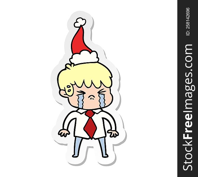hand drawn sticker cartoon of a boy crying wearing santa hat