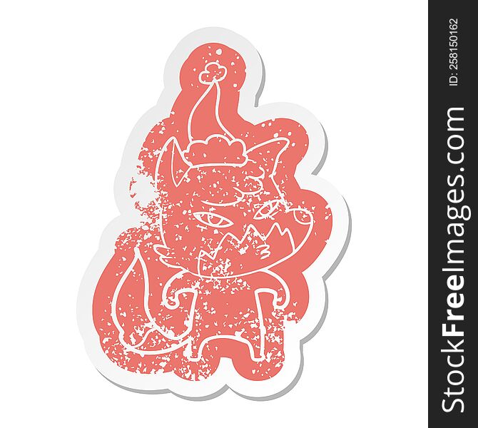 Clever Cartoon Distressed Sticker Of A Fox Wearing Santa Hat