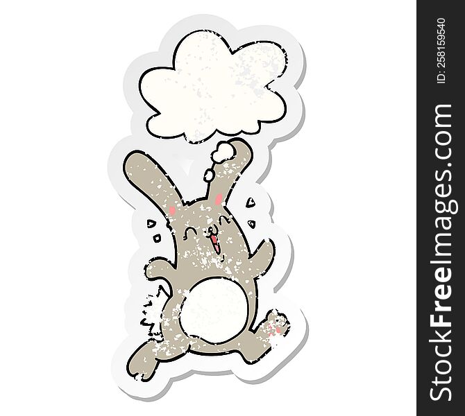 cartoon rabbit with thought bubble as a distressed worn sticker