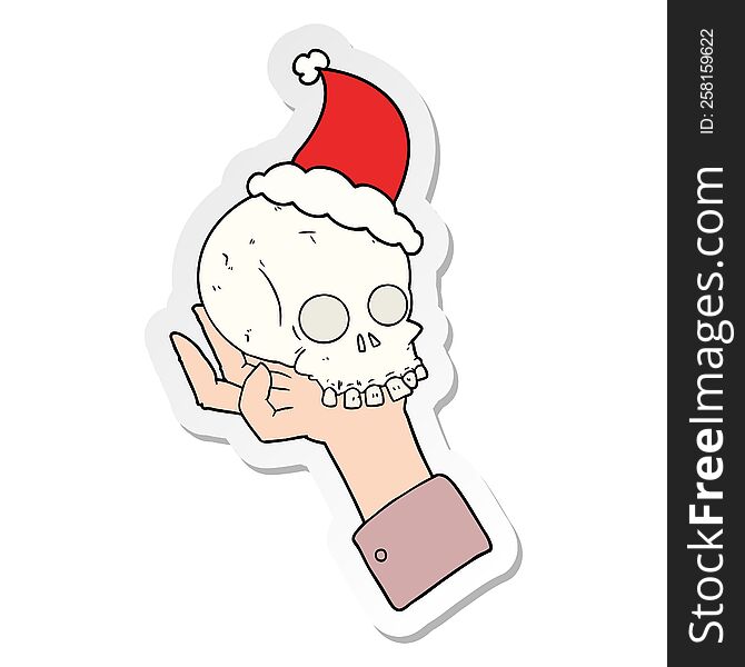 hand drawn sticker cartoon of a hand holding skull wearing santa hat