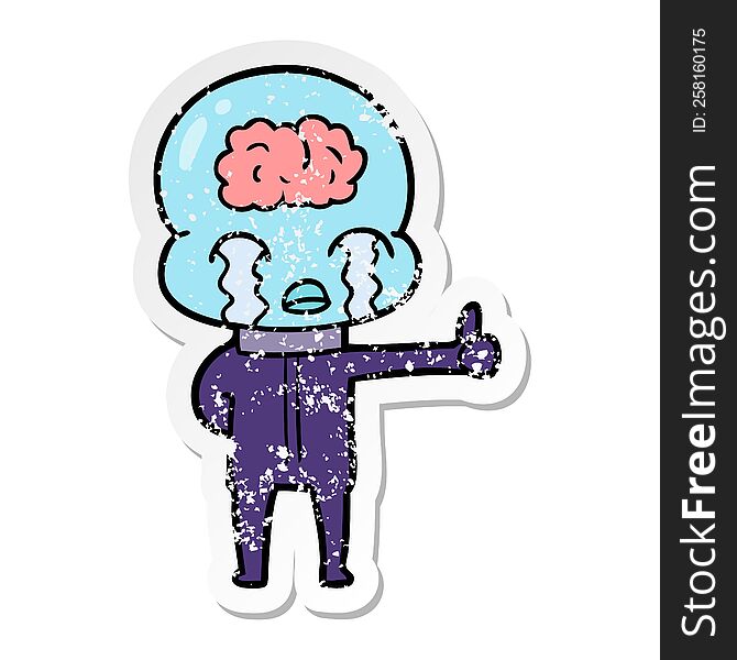 distressed sticker of a cartoon big brain alien crying but giving thumbs up symbol