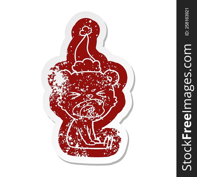 angry quirky cartoon distressed sticker of a bear wearing santa hat