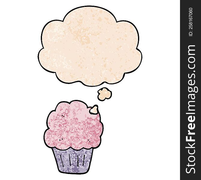 cartoon cupcake with thought bubble in grunge texture style. cartoon cupcake with thought bubble in grunge texture style