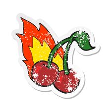 Retro Distressed Sticker Of A Cartoon Flaming Cherries Stock Photography