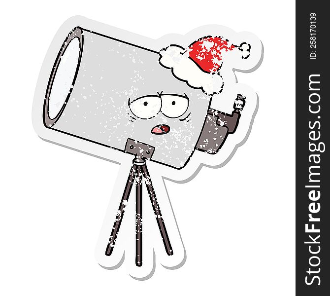 hand drawn distressed sticker cartoon of a bored telescope with face wearing santa hat