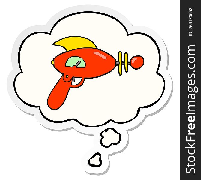 cartoon ray gun with thought bubble as a printed sticker