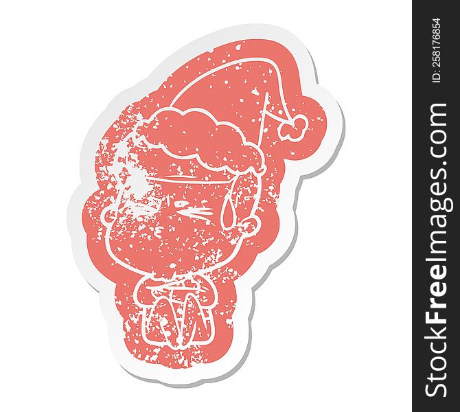 Cartoon Distressed Sticker Of A Man Sweating Wearing Santa Hat