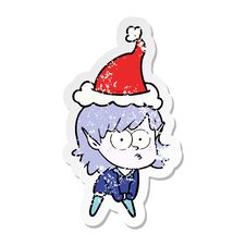 Distressed Sticker Cartoon Of A Elf Girl Staring And Crouching Wearing Santa Hat Stock Photos