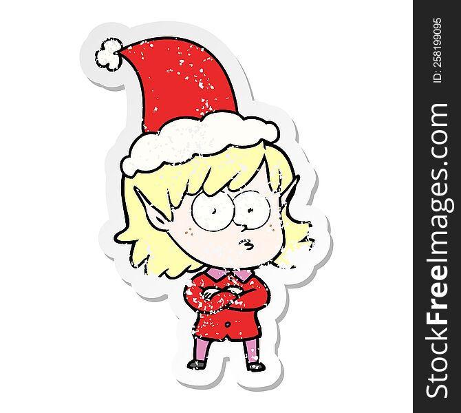 hand drawn distressed sticker cartoon of a elf girl staring wearing santa hat