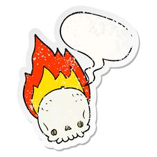 Spooky Cartoon Flaming Skull And Speech Bubble Distressed Sticker Stock Image
