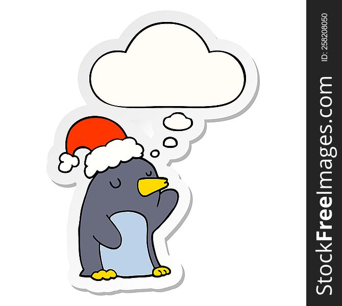 cute cartoon christmas penguin with thought bubble as a printed sticker