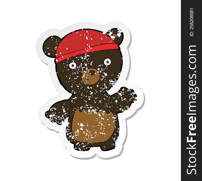 Retro Distressed Sticker Of A Cartoon Black Bear Wearing Hat