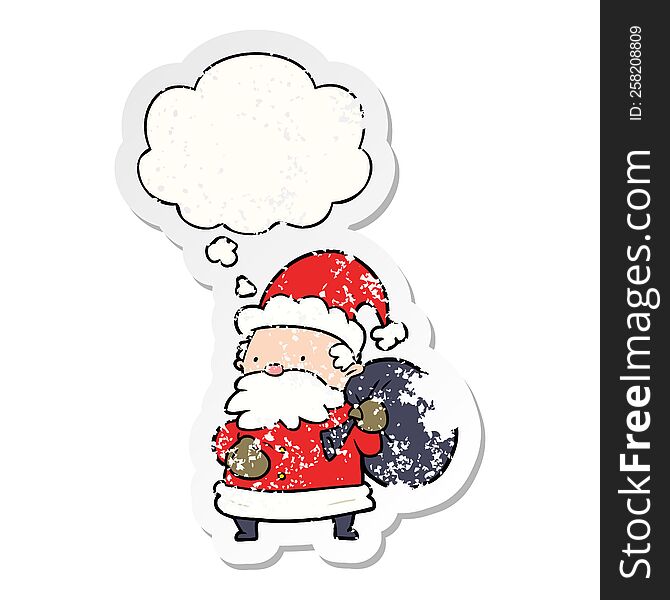 cartoon santa claus with thought bubble as a distressed worn sticker