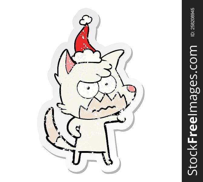 Distressed Sticker Cartoon Of A Annoyed Fox Wearing Santa Hat