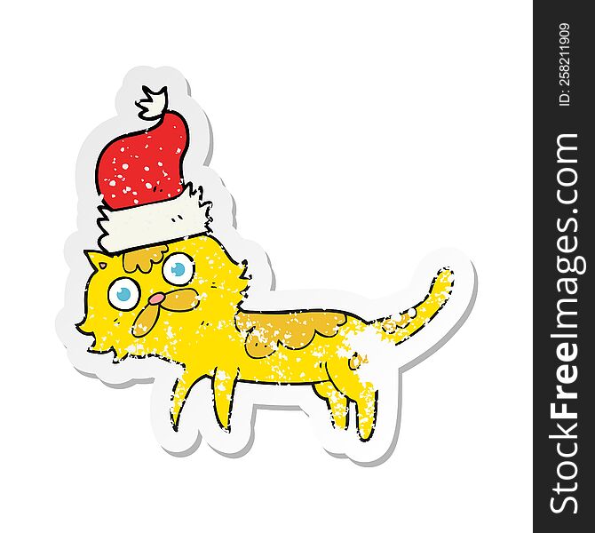 Retro Distressed Sticker Of A Cartoon Cat Wearing Christmas Hat