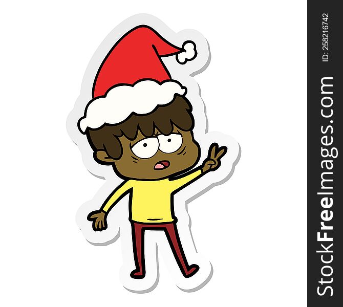 Sticker Cartoon Of A Exhausted Boy Wearing Santa Hat