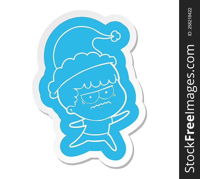 quirky cartoon  sticker of a annoyed man wearing santa hat