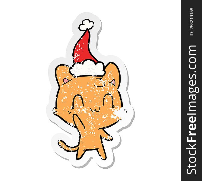 Distressed Sticker Cartoon Of A Happy Cat Wearing Santa Hat