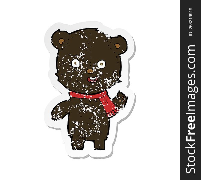retro distressed sticker of a cartoon waving black bear cub with scarf