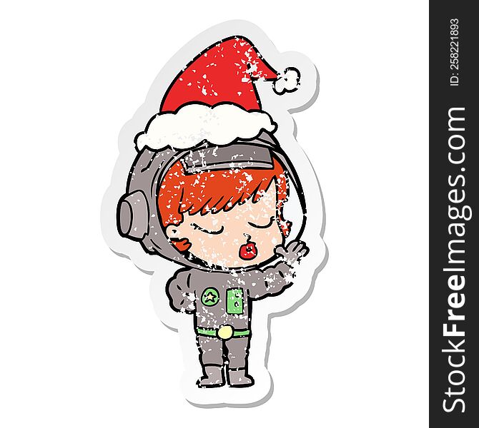 distressed sticker cartoon of a pretty astronaut girl wearing santa hat