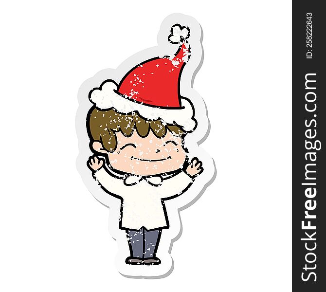 hand drawn distressed sticker cartoon of a happy boy wearing santa hat