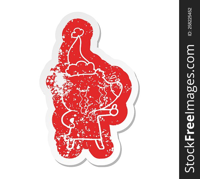 Cartoon Distressed Sticker Of A Crying Bear Wearing Santa Hat