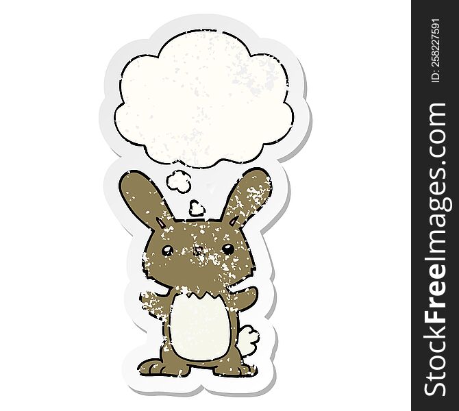 cute cartoon rabbit with thought bubble as a distressed worn sticker