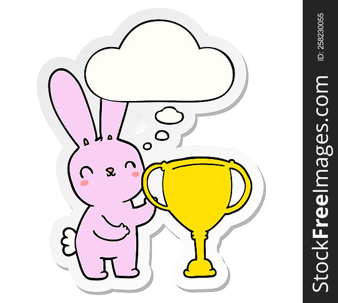 cute cartoon rabbit with sports trophy cup with thought bubble as a printed sticker