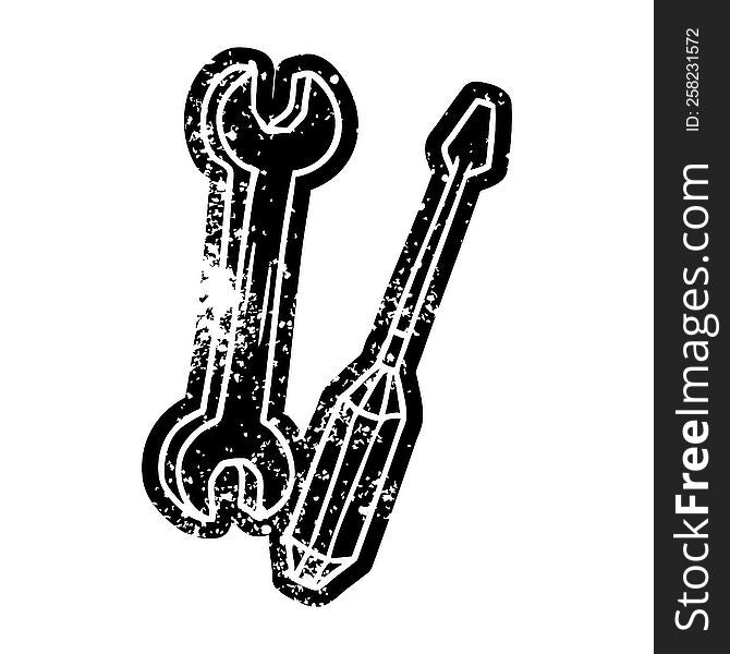 grunge distressed icon of a spanner and a screwdriver. grunge distressed icon of a spanner and a screwdriver