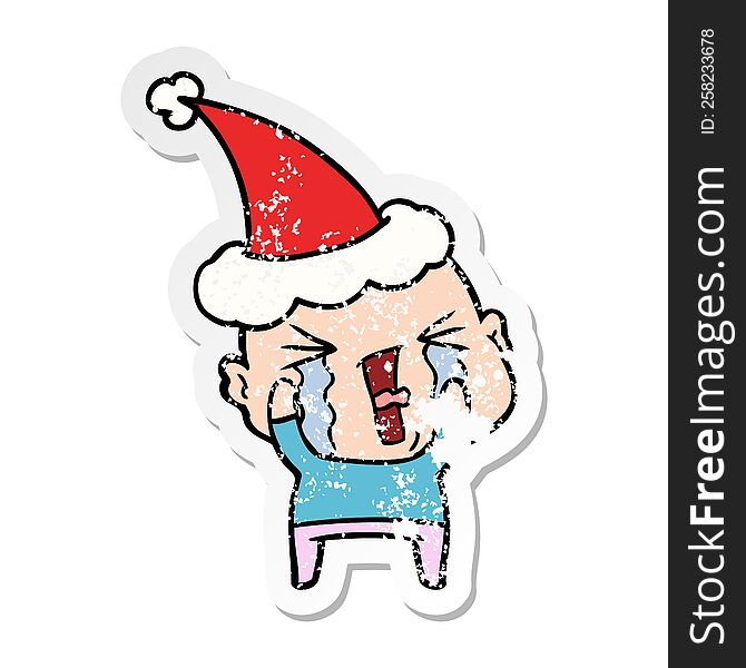 Distressed Sticker Cartoon Of A Crying Bald Man Wearing Santa Hat