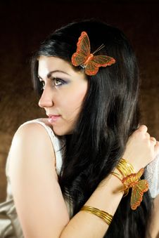Brunette With Brown-gold Butterfly Royalty Free Stock Photography
