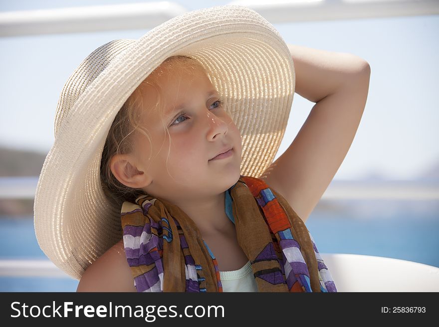Portrait of a girl wearing a hat outdoors during the day in the summer. Portrait of a girl wearing a hat outdoors during the day in the summer