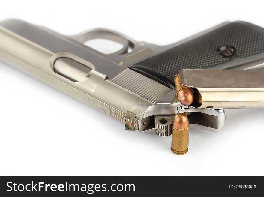 Close up of bullets and Semi-automatic gun on white background