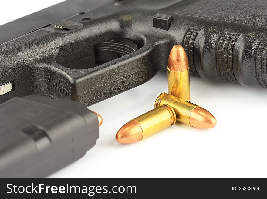 Close up of bullets and Semi-automatic gun on white background