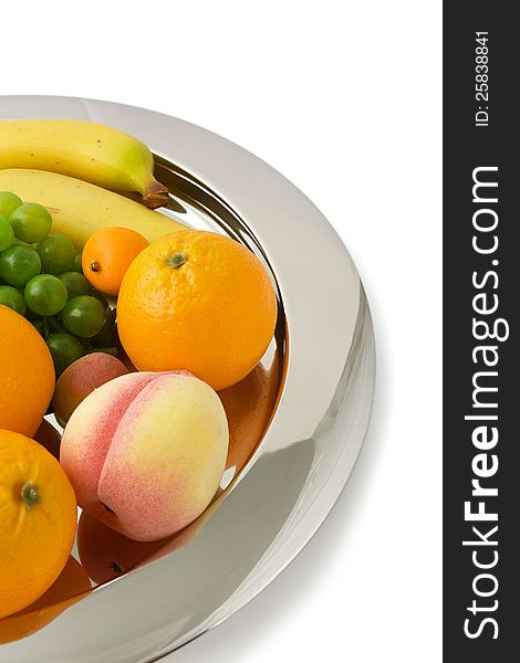Decoration with fruits on shining metal centerpiece. Decoration with fruits on shining metal centerpiece