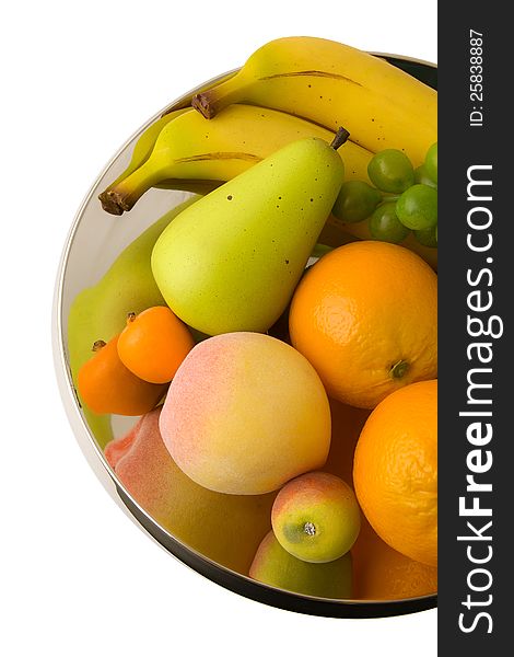 Fruits on shining metal centerpiece. Fruits on shining metal centerpiece