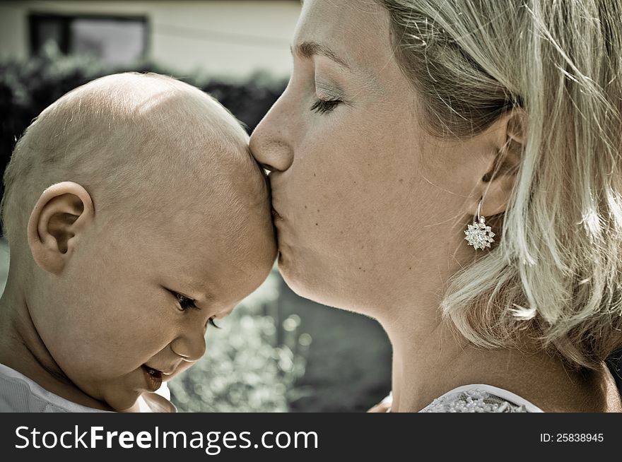 Blondie woman with baby in retro style. Blondie woman with baby in retro style