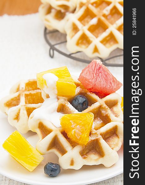 Belgian waffles and fruits for breakfast