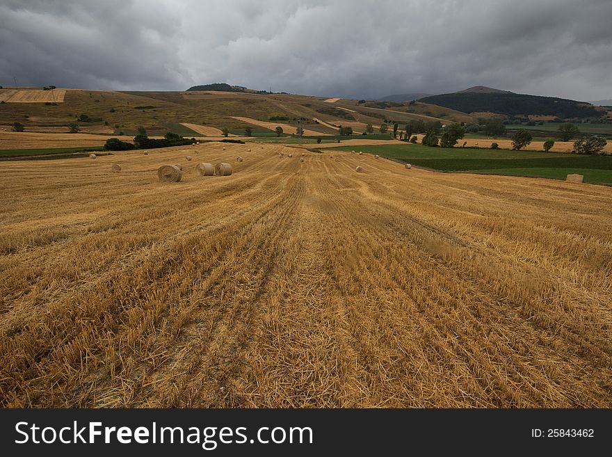 Italian countryside in the summer with many clouds