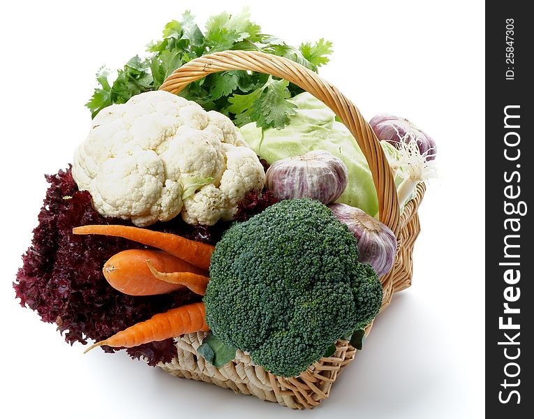 Basket of Cabbage, Broccoli and Cauliflower with Raw Vegetables isolated on white background. Basket of Cabbage, Broccoli and Cauliflower with Raw Vegetables isolated on white background