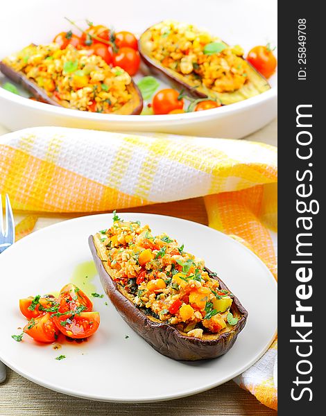 Baked aubergines stuffed with cheese , meat and vegetables. Baked aubergines stuffed with cheese , meat and vegetables