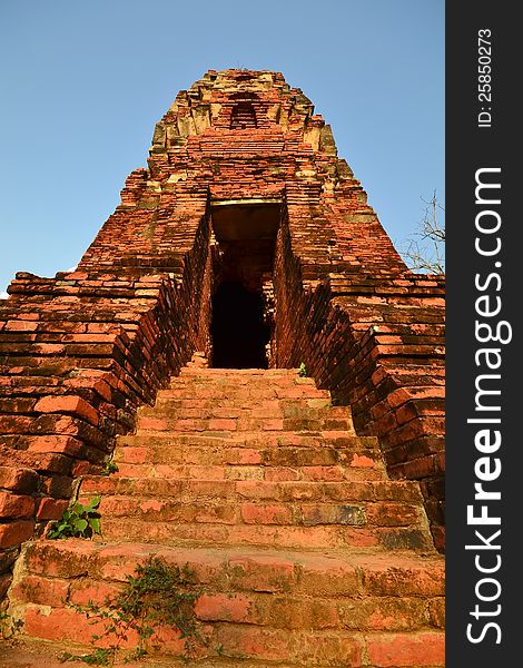 Ancient pagoda stairs and entrance on blue background
