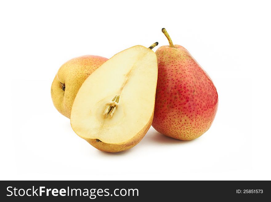 Two and half red pears on white background