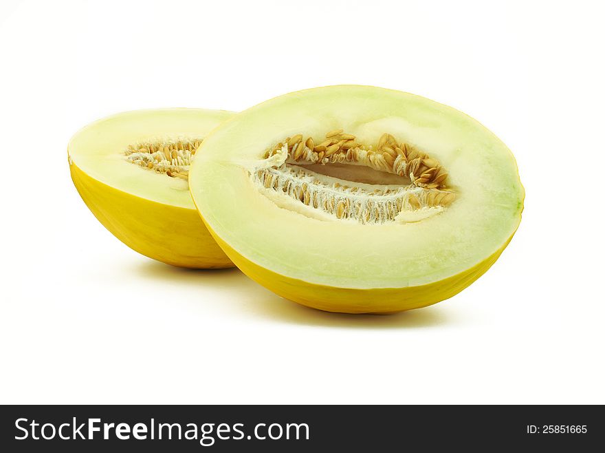 Two halves of yellow melon on white background. Two halves of yellow melon on white background