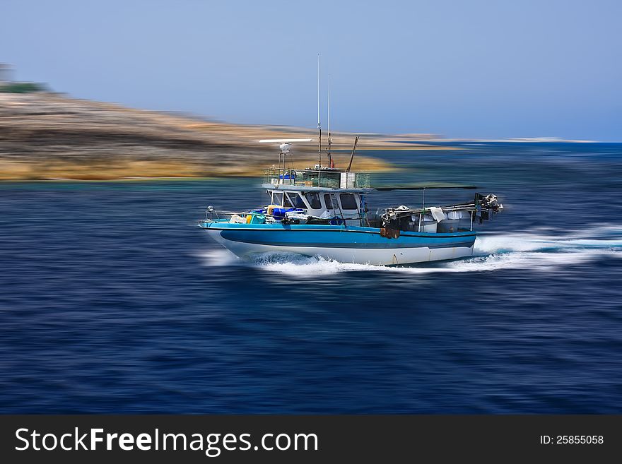 Fishing boat on way back to harbour. Fishing boat on way back to harbour