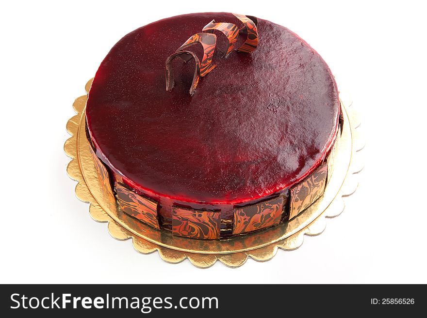 Red Cake with French Chocolate with red berry close-up. Red Cake with French Chocolate with red berry close-up