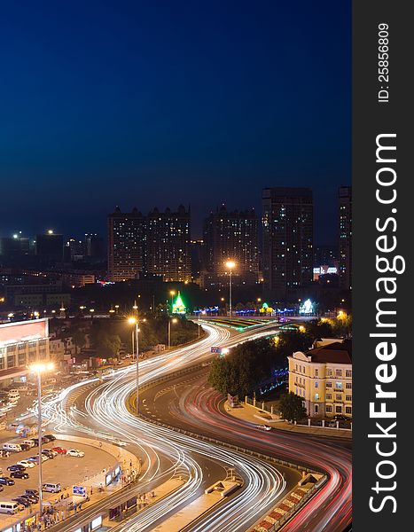 This image was taken from the top of an apartment and show Harbin, China illuminated at night. This image was taken from the top of an apartment and show Harbin, China illuminated at night.