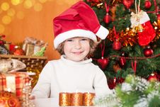Happy Smiling Child In Santa`s Hat Stock Images Happy Smiling Child In Santa`s Hat Stock Images