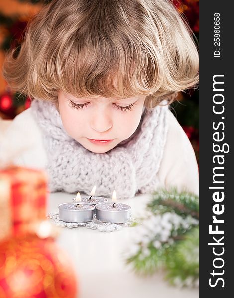 Child Blowing Out Candles